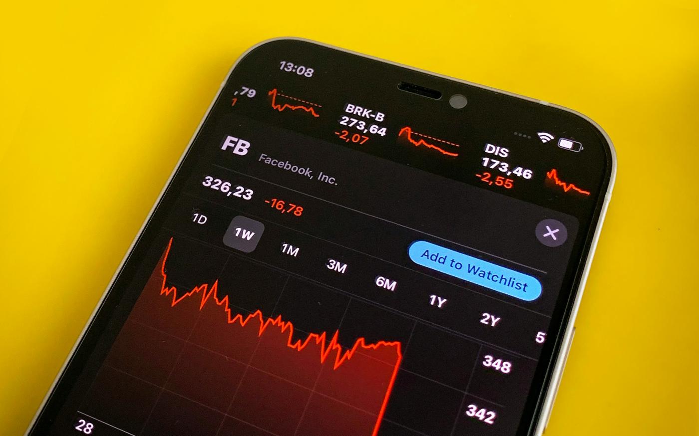 a cell phone with a chart on the screen by Hakan Nural courtesy of Unsplash.